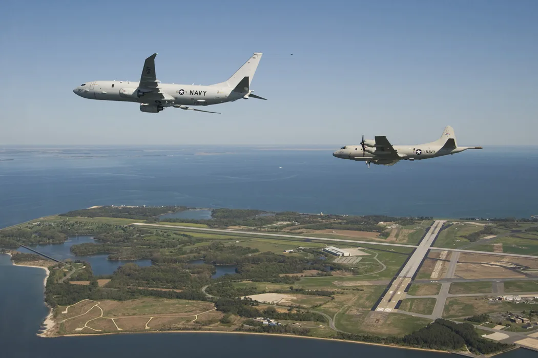 The U.S. Navy’s newest maritime patrol and reconnaissance test aircraft, P-8A Poseidon flies with a P-3C Orion along side, prior to landing at Naval Air Station Patuxent River, Md., on April 10, 2010. The P-8A began its formal flight test p