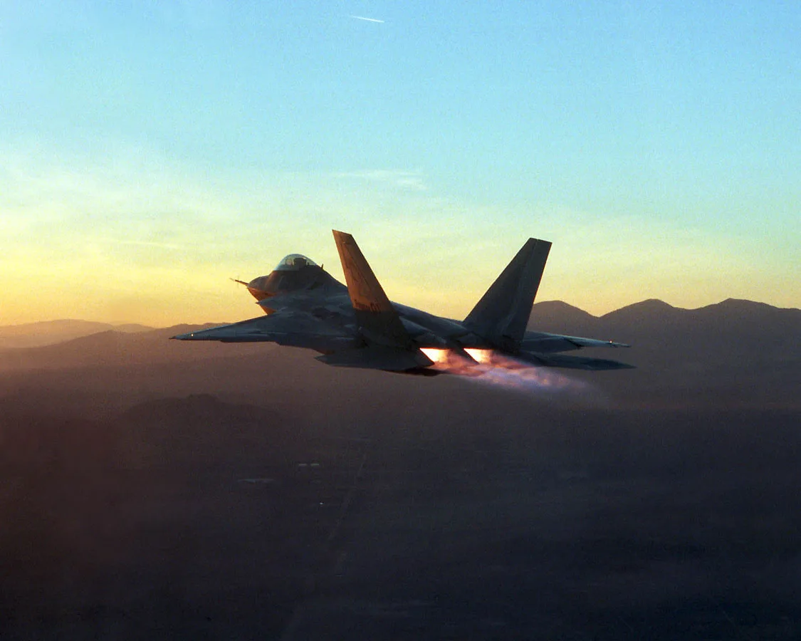 FILE PHOTO -- An F-22 Raptor in full afterburner during flight testing at Edwards Air Force Base, California, US. The Raptor is the replacement for the F-15 Eagle. It is the most advanced fighter aircraft in the world, combining a revolutio